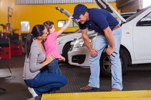 Family kid with Mechanic - Meineke Alabama Regular Maintenance | Meineke Car Care | Madison, AL