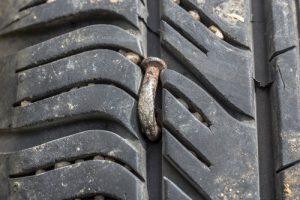 Close,Up,Of,Nail,Puncturing,Tire - Meineke Alabama Meineke Car Care | Tire Plugs | Madison AL